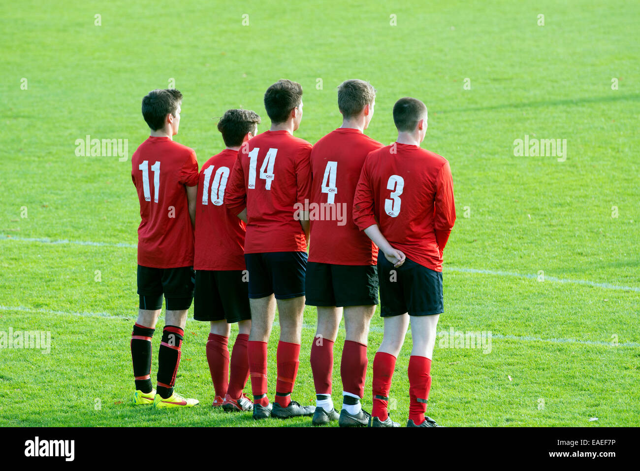 University sport UK, men`s football. Players forming a defensive wall